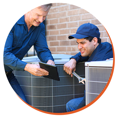 Technicians servicing HVAC units outdoors